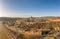 Aerial drone shot of Buda Castle palace facade on hill in Budapest sunrise glow