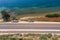 Aerial drone shot of car off road stuck at Adriatic coastline near Galesnjak in Dalmatia Croatia