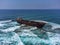 Aerial drone shot of cargo shipwreck in Paphos with waves Cyprus island storm Mediterranean sea