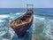 Aerial drone shot of cargo shipwreck in Paphos with waves Cyprus island storm Mediterranean sea