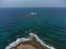 Aerial drone shot of cargo shipwreck in Paphos with waves Cyprus island storm Mediterranean sea