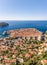 Aerial drone shot of Dubrovink city old town with view of Lokrum island in Croatia summer morning