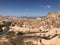 Aerial drone shot of the Fairy Chimneys over the landscape of Goreme, Cappadocia.