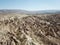 Aerial drone shot of the Fairy Chimneys over the landscape of Goreme, Cappadocia.