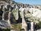 Aerial drone shot of the Fairy Chimneys over the landscape of Goreme, Cappadocia.