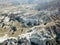 Aerial drone shot of the Fairy Chimneys over the landscape of Goreme, Cappadocia.