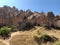 Aerial drone shot of the Fairy Chimneys over the landscape of Goreme, Cappadocia.