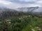 Aerial Drone Shot Flying by Cloudy Misty Foggy Lushoto village in Usambara Mountains. Remote Place in Tanga Province