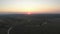 Aerial drone shot flying over river. Sunset, high altitude flight