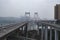 Aerial drone shot of flyover highway to E`GongYan Bridge with Chinese name on the bridge in Chongqing, China