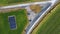 Aerial drone shot of a fork in the road in a meadow in Germany in December