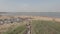 Aerial drone shot of long queue of vehicles waiting line at local toll bamboo bridge as backdrop