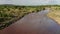 Aerial drone shot of Mara River Landscape Scenery and Giraffe Crossing in Masai Mara, Wildlife Safar