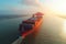 Aerial drone shot of massive container ship departing from logistics terminal, dynamic harbor view