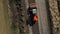 Aerial drone shot of Paver mover on a flat newly made road, ramming and leveling. Asphalt paver applying asphalt on the