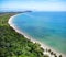 Aerial drone shot of the pure ocean water and the coast