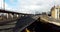 Aerial drone shot reveals spectacular elevated highway and convergence of roads, bridges, viaducts in Glasgow at sunset,