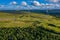 Aerial drone shot of several clean energy wind turbines in a rural area of South Wales, UK