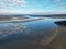 Aerial drone shot of a shallow river with reflections in Appledore village, North Devon, England