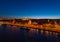 Aerial drone shot of St. Anne Parish church by Danube river at Budapest dusk city lights on