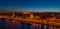 Aerial drone shot of St. Anne Parish church by Danube river at Budapest dusk city lights on