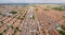 Aerial drone shot of suburb area surrounded by high density village in overpopulation city for housing and real estate property