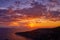 Aerial drone shot sunset over Adriatic horizon from Komiza town port on Vis Island in Croatia summer