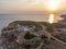 Aerial drone shot of the sunset over the lighthouse at Stora Karlso, Sweden