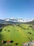 Aerial drone shot of village Garmisch Partenkirchen with view of Zugspitze in fog