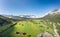 Aerial drone shot of village Garmisch Partenkirchen with view of Zugspitze in fog