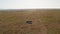 Aerial drone shot of Wildlife Photographer Driving Safari Vehicle in Maasai Mara National Reserve Sa