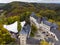 Aerial Drone Shot in Wiltz Luxembourg. View on a Castle at cloudy autumn day in Wiltz