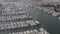 Aerial drone shot of yachts and sailboats docked at the marina in Los Angeles