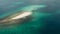 Aerial drone of small white island sandbar of Britania Island.