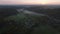 Aerial drone Sunrise view Above autumn colored forest and Valleys in Luxembourg, covered in morning fog