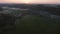 Aerial drone Sunrise view Above autumn colored forest and Valleys in Luxembourg, covered in morning fog