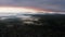 Aerial drone sunrise view over foggy countryside with wooden houses