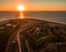 Aerial Drone Sunset Photo - Beautiful ocean sunset over historic Fort Morgan, Alabama