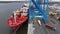 Aerial Drone Timelapse of Cargo Ship Being Loaded and Unloaded in Port