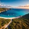 Aerial drone top down photo of beautiful red fishing boat anchored in small paradise island of Monolia in small