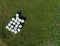 Aerial drone top down view on green meadow with foiled hay round bales stored for future use