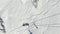 Aerial drone top view team of freeriders skier ski touring in the snowy mountains uphill in a line