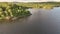 Aerial drone video above girl paddling in green kayak, mountain lake in Scandinavian mountains. Norway, Sweden