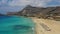 Aerial drone video of Falassarna beach, crystal waters, golden sand, endless sandy turquoise beach of Falassarna in Crete island,
