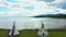 Aerial drone video, panning from left to right, near tipis facing a bay in Maria in Gaspesie, Quebec