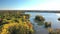 Aerial drone video rotating from right to left revealing the surrounding in Laval-Ouest, over the Mille Iles river showing the