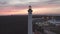 Aerial drone video of Vila Real de Santo Antonio city, lighthouse farol and stadium in Portugal, at sunset