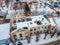 Aerial drone view of abandoned ruined building after fire and collapsing roof in winter