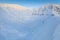 Aerial drone view of the amazing curved windy road motorway Transfagarasan in Romania during a winter morning landscape with mount