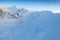 Aerial drone view of the amazing curved windy road motorway Transfagarasan in Romania during a winter morning landscape with mount